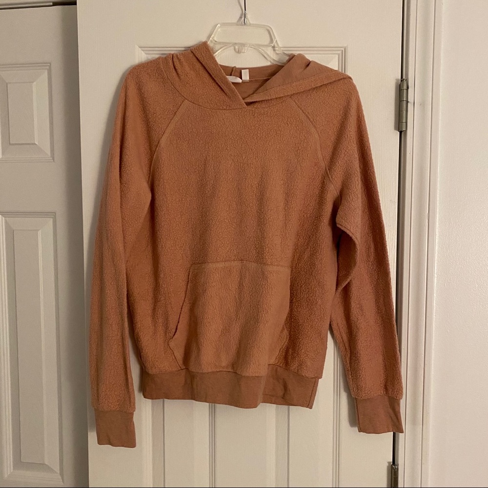 Peach colored sweatshirt